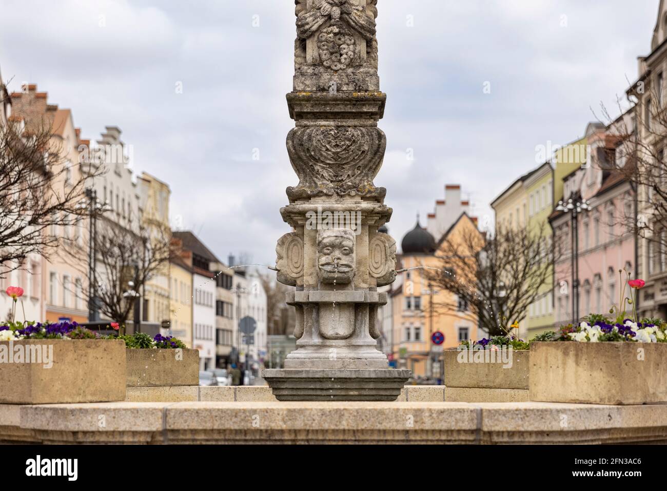 Historical gothic style statue and fountain in Bavarian city Straubing in Germany. Stock Photo