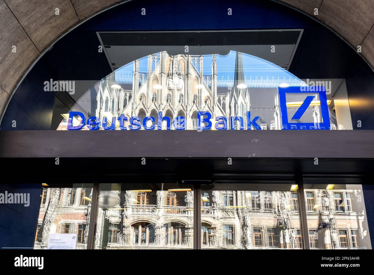 Deutsche Bank logo on the window of a branch in Munich Stock Photo Alamy