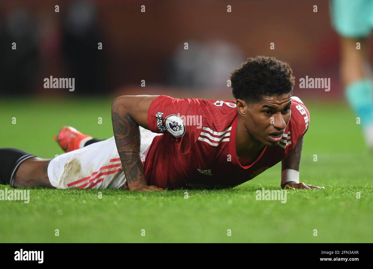 Manchester United's Marcus Rashford gets up of the turf during the Premier League match at Old Trafford, Manchester. Picture date: Thursday May 13, 2021. Stock Photo