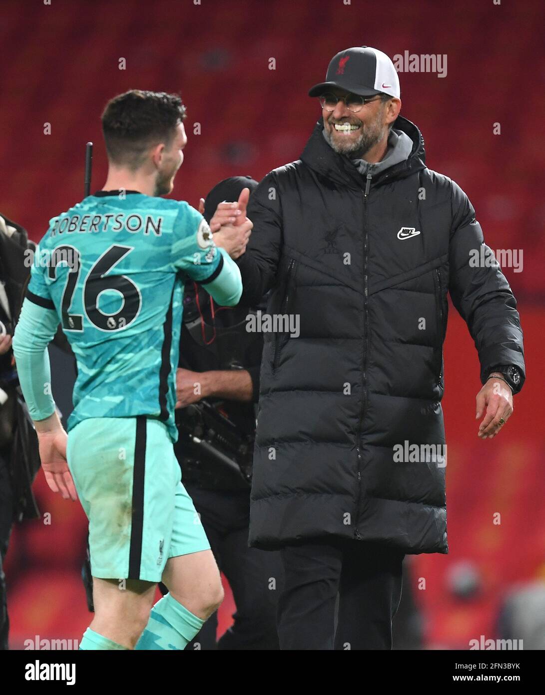 Liverpool manager Jurgen Klopp with Andrew Robertson after the Premier League match at Old Trafford, Manchester. Picture date: Thursday May 13, 2021. Stock Photo