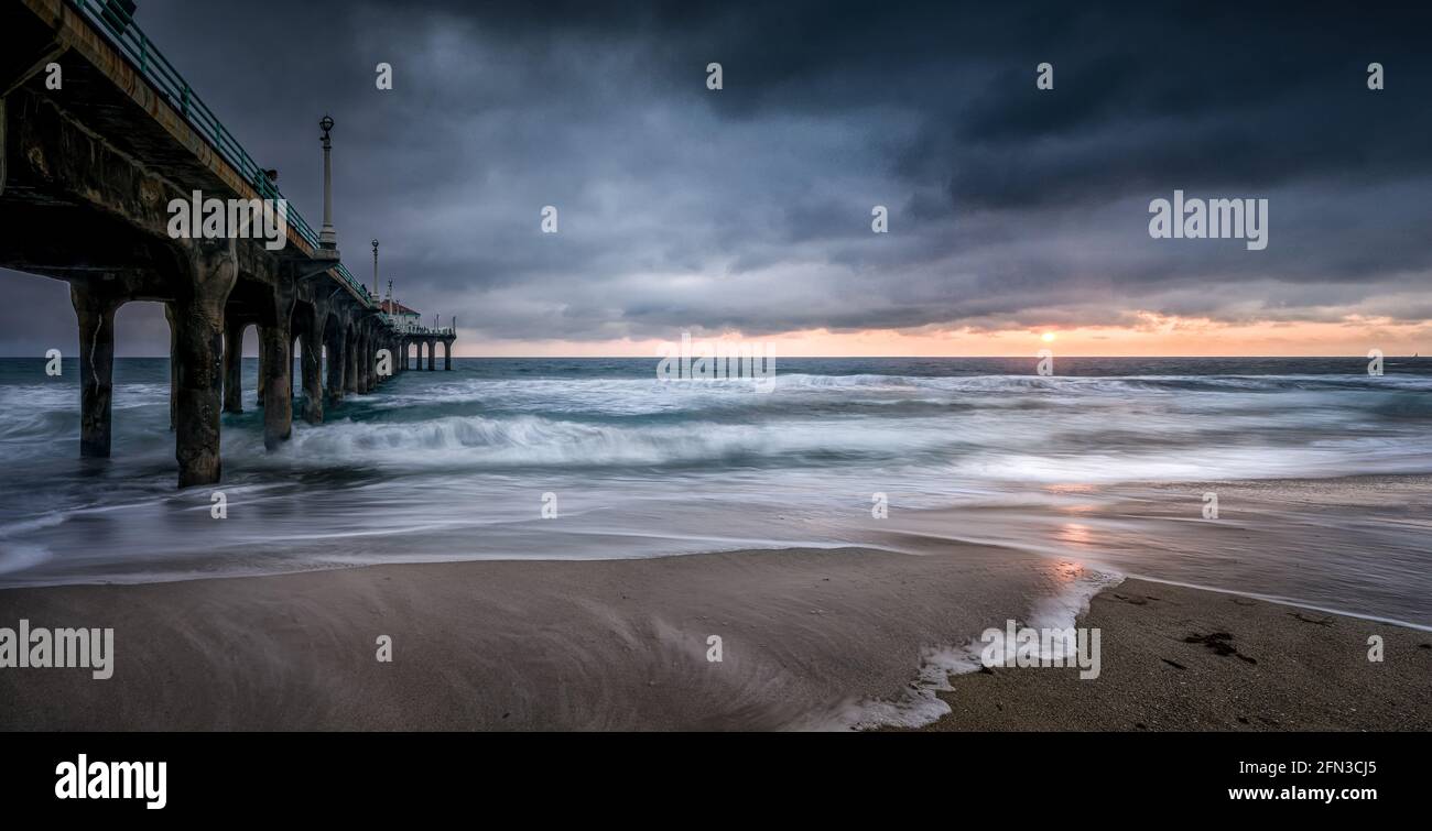 The Manhattan Beach Pier is a pier located in Manhattan Beach, California, on the coast of the Pacific Ocean. Stock Photo