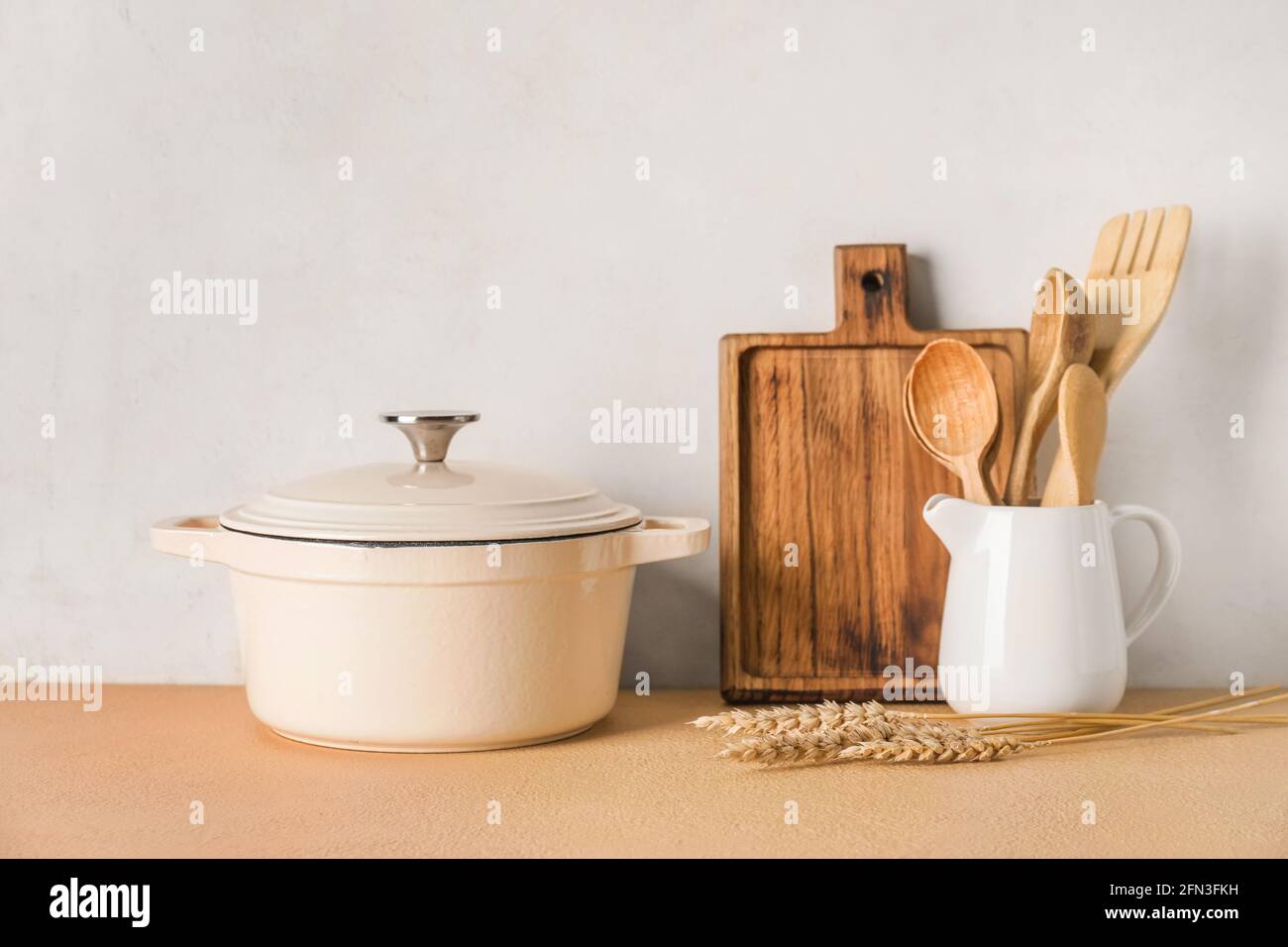 Set of kitchen utensils on light background Stock Photo - Alamy