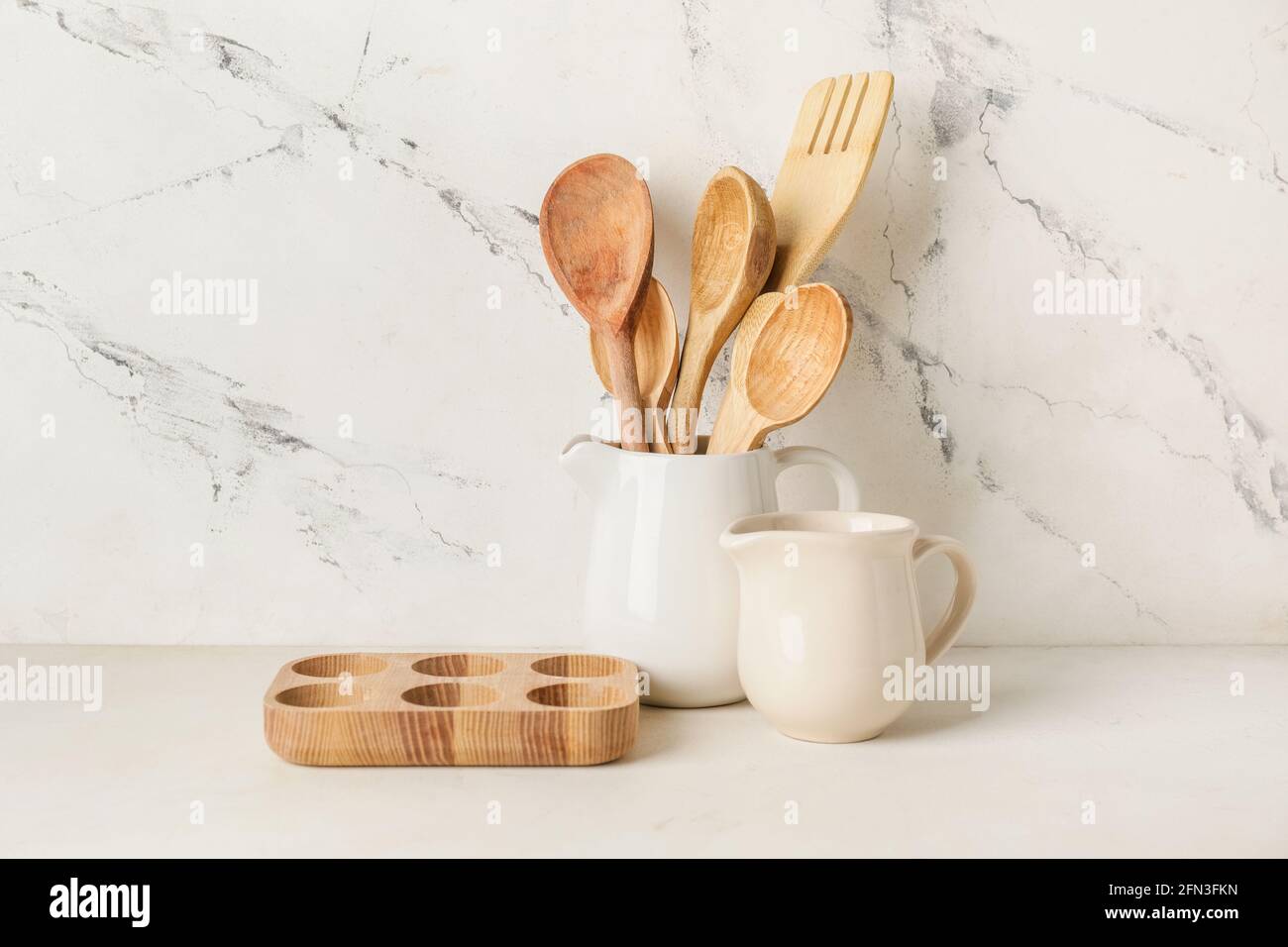 Set of kitchen utensils on light background Stock Photo - Alamy