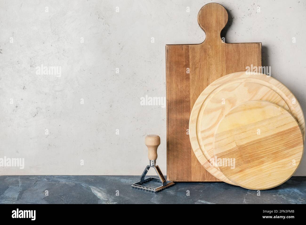 Wooden chopping boards and mold on light background Stock Photo Alamy