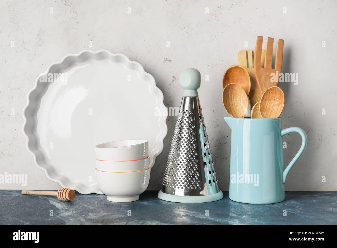 Set of kitchen utensils on light background Stock Photo - Alamy
