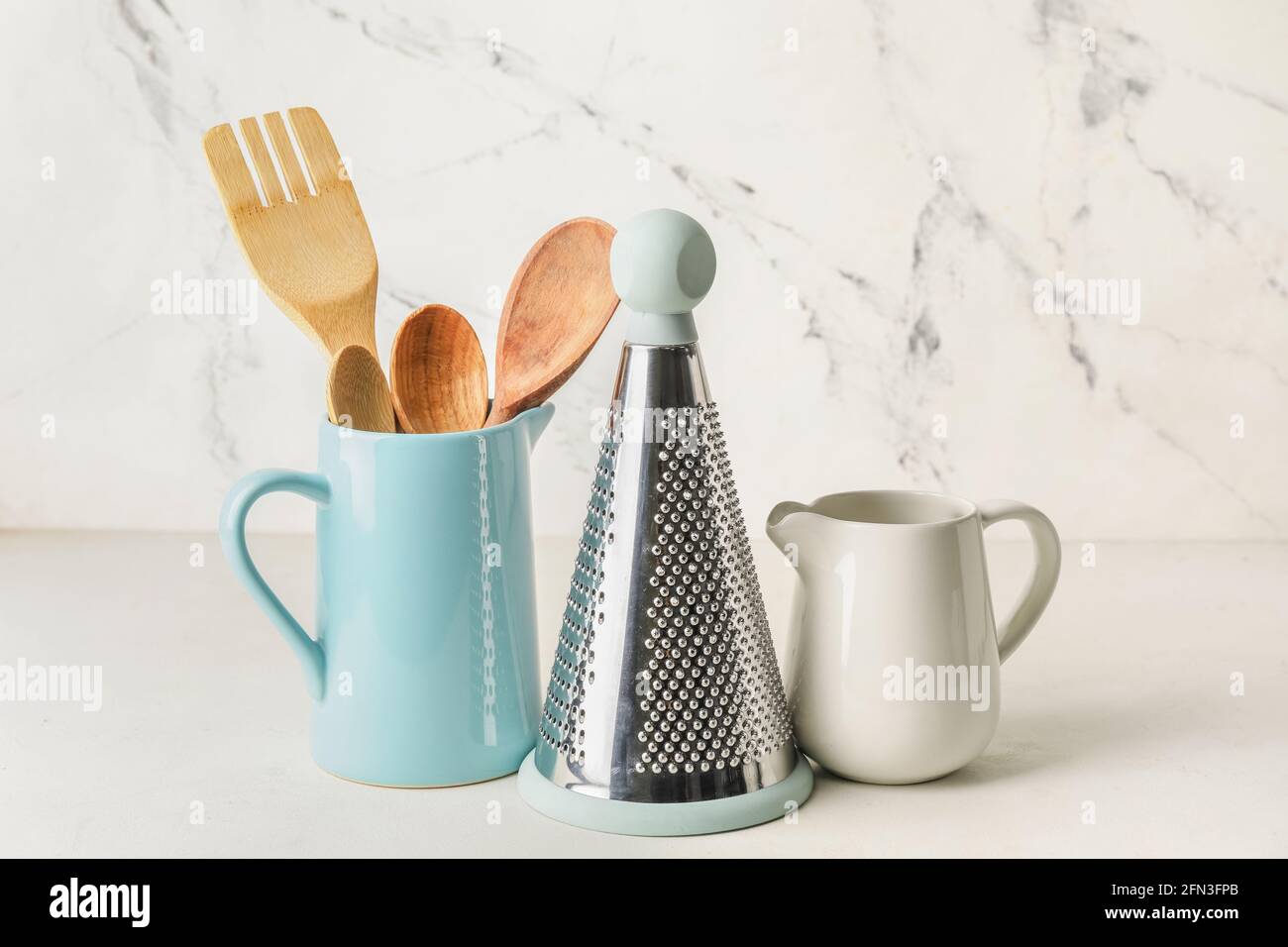 Set of kitchen utensils on light background Stock Photo - Alamy