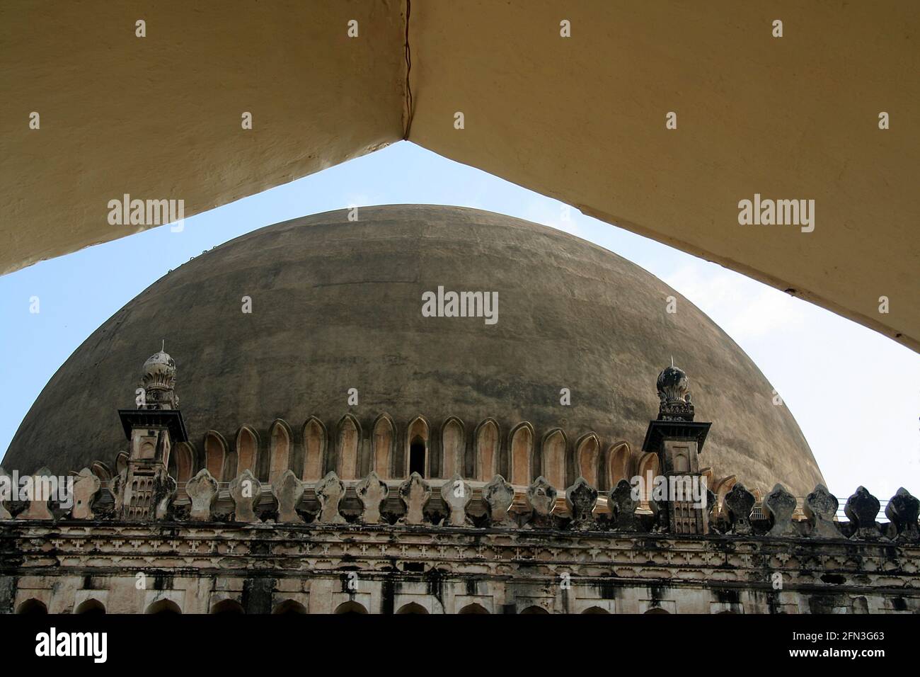 View of the dome through an arch at the entrance of Gol Gumbaz, Bijapur, Karnataka, India, Asia Stock Photo