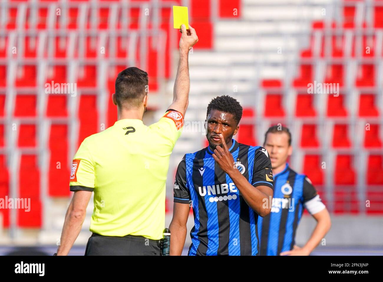 ANTWERP, BELGIUM - MAY 13: Clinton Mata of Club Brugge receiving a yellow card by referee Bram van Driessche during the Jupiler Pro League match betwe Stock Photo