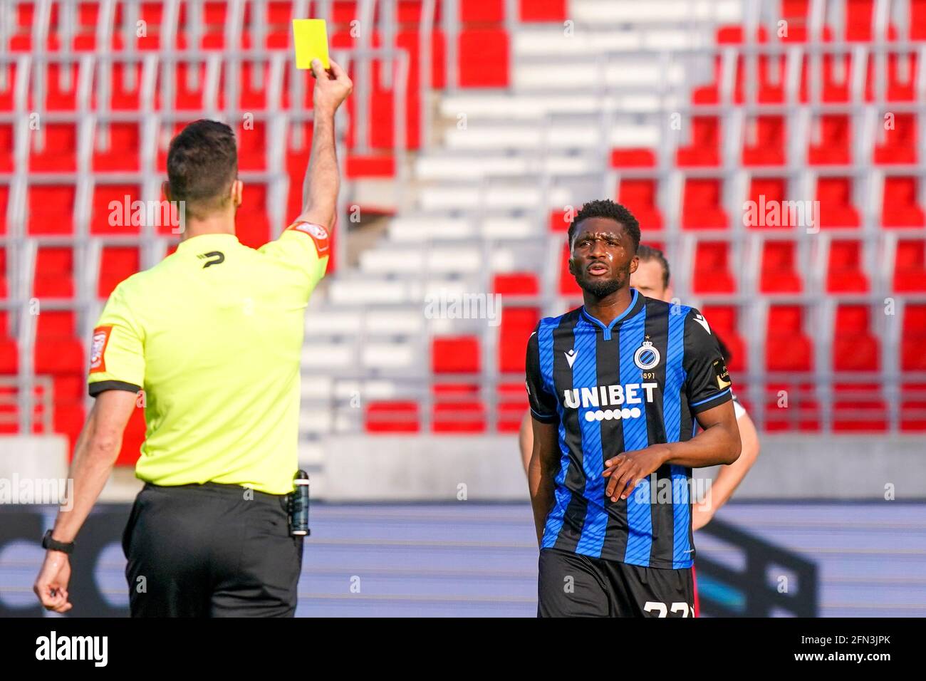 ANTWERP, BELGIUM - MAY 13: Clinton Mata of Club Brugge receiving a yellow card by referee Bram van Driessche during the Jupiler Pro League match betwe Stock Photo