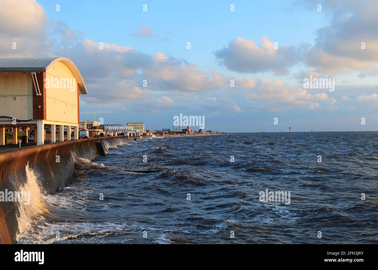 Hunstanton, sea front, amusements, funfair, high tide, seaside resort, sea wall, The Wash, Norfolk, England Stock Photo