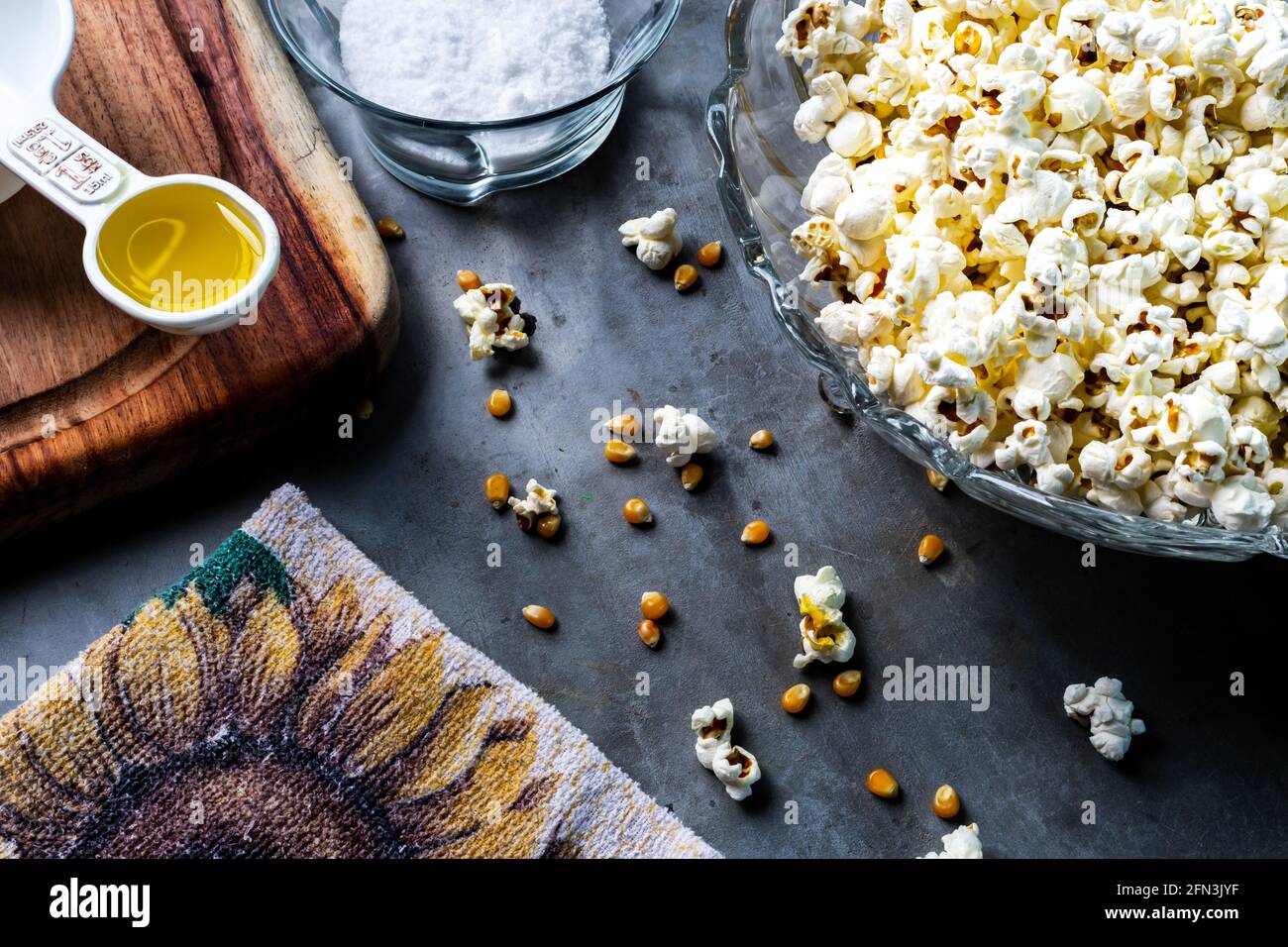 Popcorn with salt and oil and sunflower kitchen towel Stock Photo Alamy