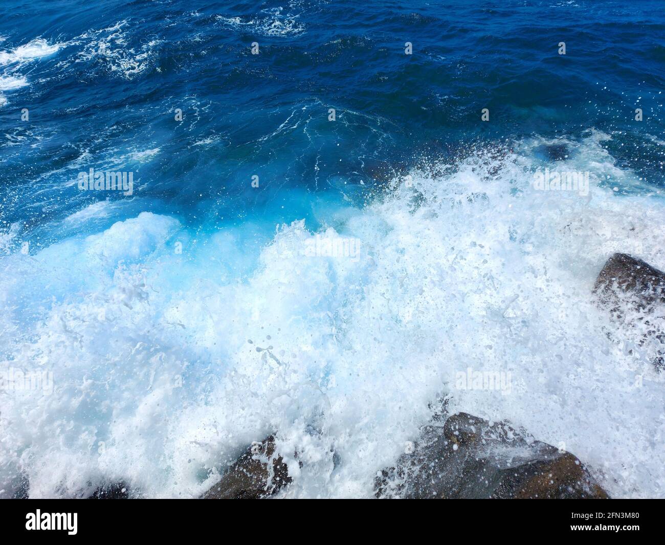Sea waves - splashes, wave break blue water and white foam Stock Photo