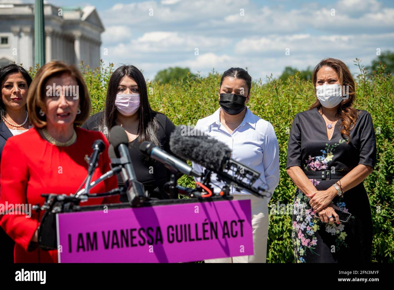 Mayra Guillen, third from left, Lupe Guillen, second from right, sisters of Vanessa Guillen, and United States Representative Veronica Escobar (Democrat of Texas), right, listen while Speaker of the United States House of Representatives Nancy Pelosi (Democrat of California) offers remarks during a press conference for the reintroduction of the I am Vanessa Guillén Act, outside the US Capitol in Washington, DC, Thursday, May 13, 2021. The killing of 20 year-old Army Specialist Vanessa Guillen at Fort Hood in Texas last year caused outrage, as Guillen's family said Vanessa was harassed prior to Stock Photo