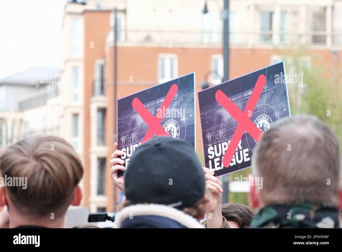 Fans protest outside Chelsea football club ground Stamford Bridge against the proposed joining of the European Super League Stock Photo