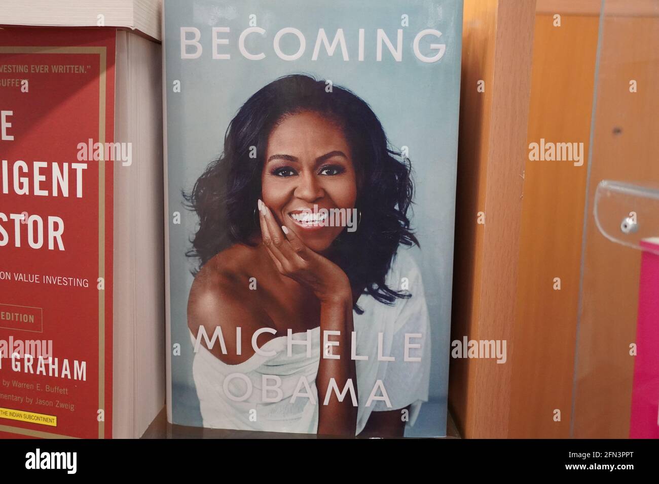 Becoming book written by Michelle Obama at the bookstore. books by Michelle Obama displayed on the shelves of a book shop. Library - Kochi, India: Jan Stock Photo
