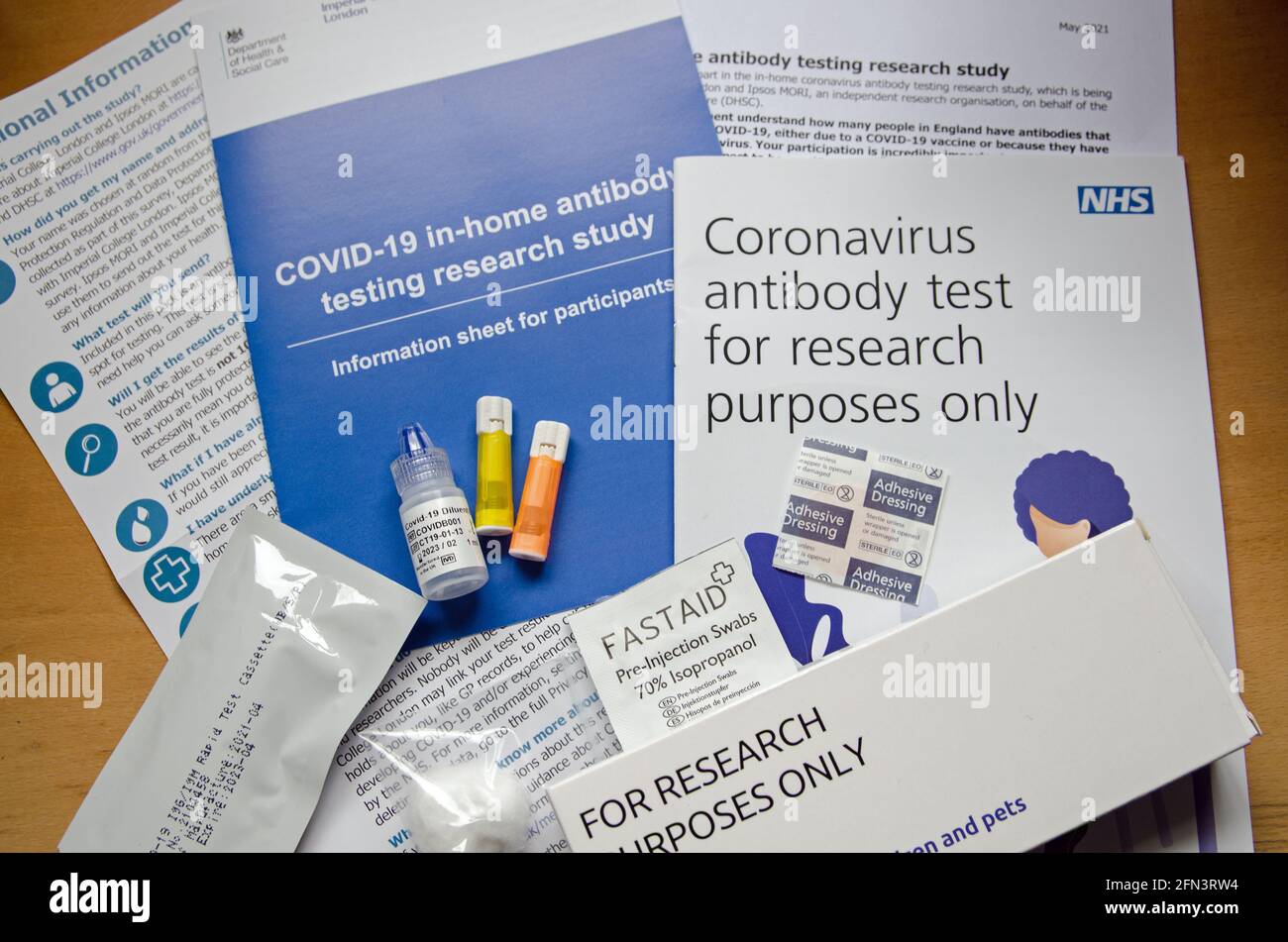 Basingstoke, UK - May 13, 2021: Equipment and paperwork for an NHS COVID-19 antibody test.  Part of the Imperial College React survey to find out how Stock Photo