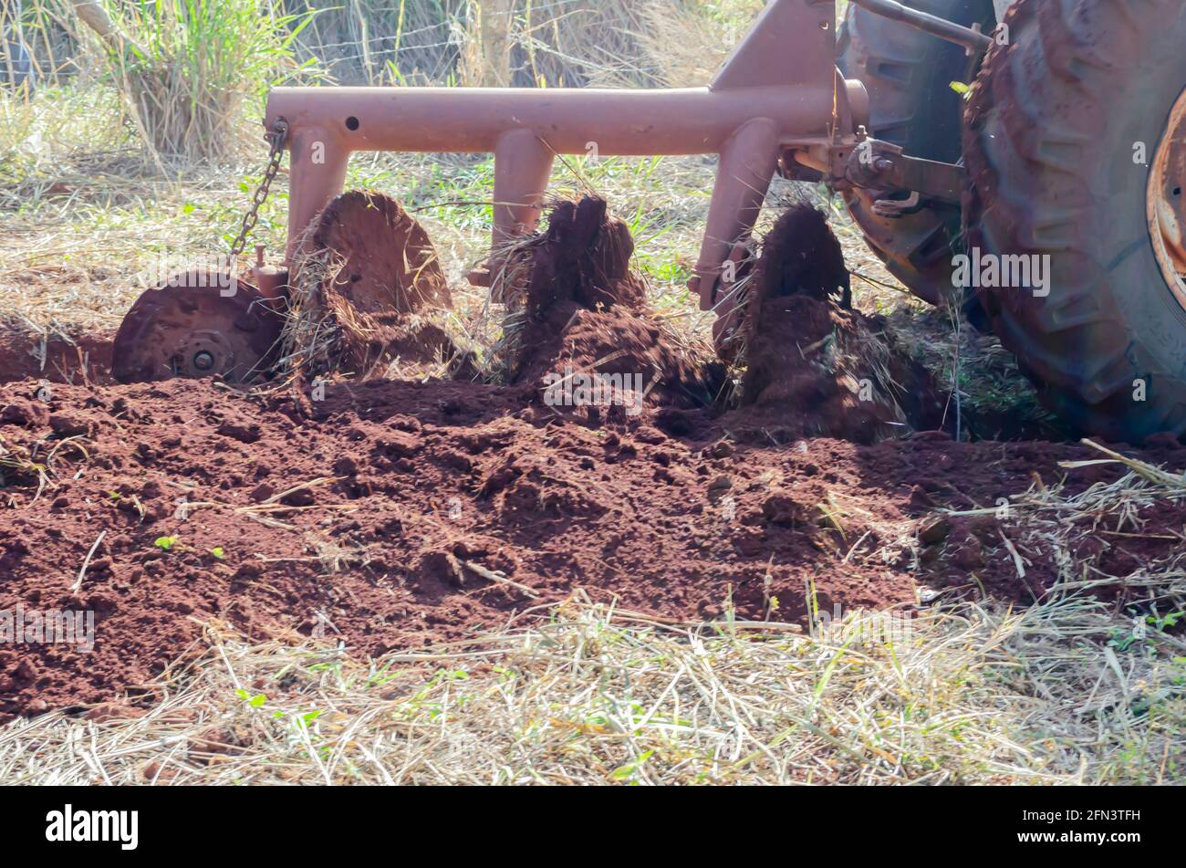 Dirt Against Plow Disc Stock Photo