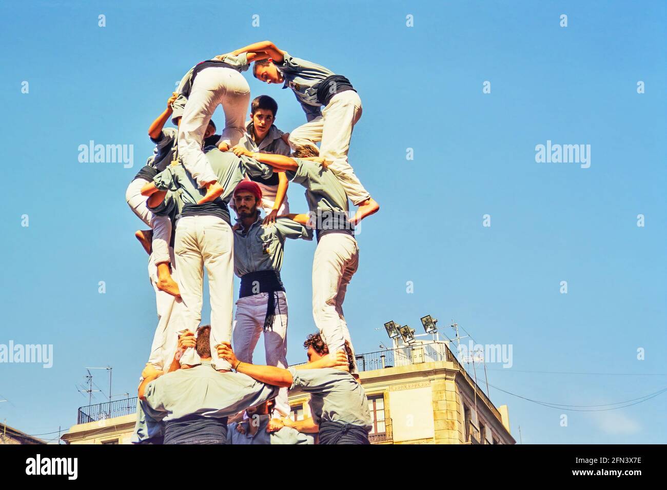Barcelona, Spain - September 23, 1999: Local people building human towers (Castellers), part of the traditional La Merce Festival, in Barcelona, Spain Stock Photo