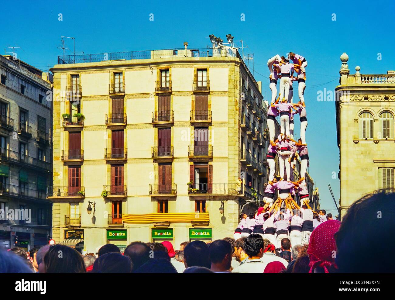 Barcelona, Spain - September 23, 1999: Local people building human towers (Castellers), part of the traditional La Merce Festival, in Barcelona, Spain Stock Photo