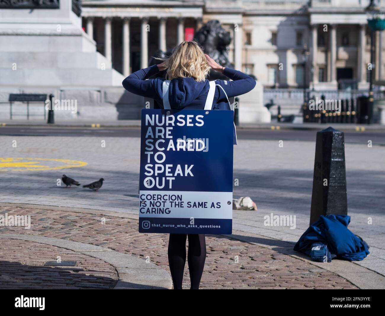 single voice demonstrator in Trafalgar Square, that nurse that asks qiuestions Stock Photo