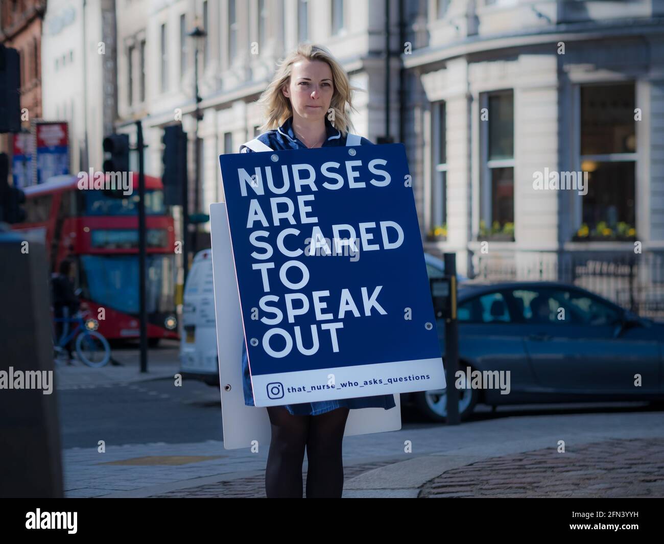 single voice demonstrator in Trafalgar Square, that nurse that asks qiuestions Stock Photo