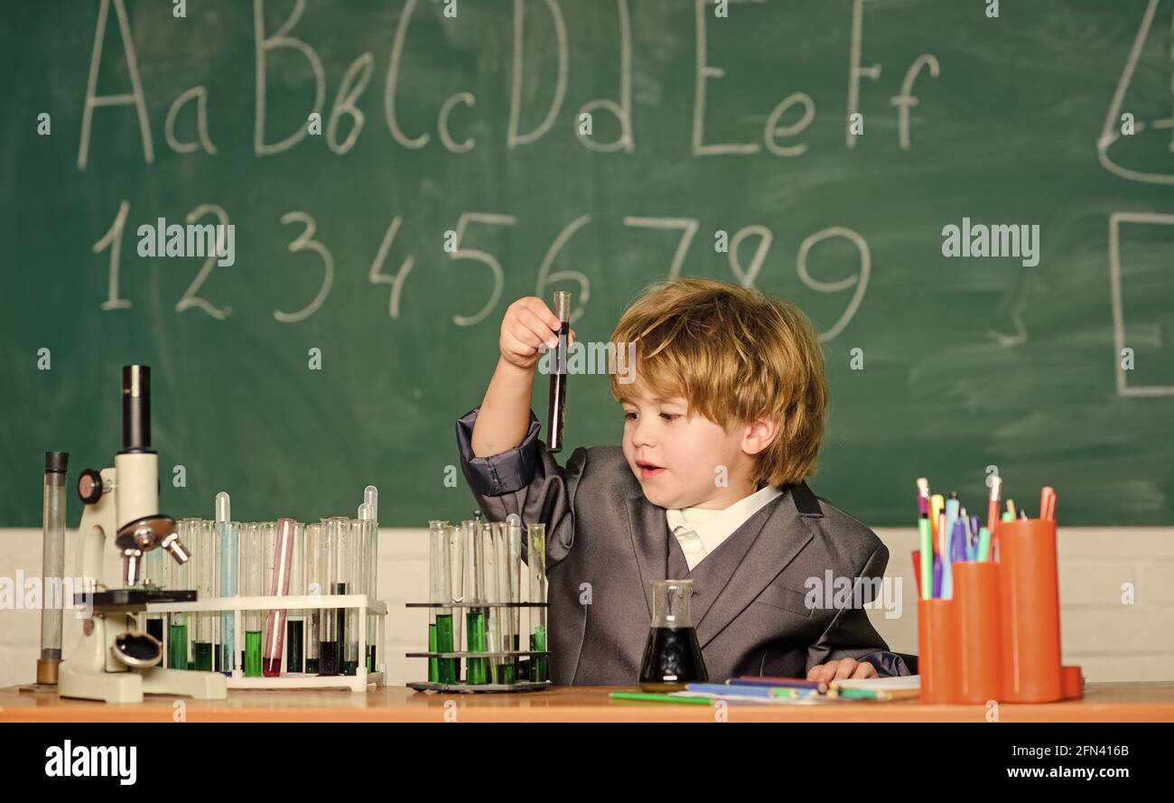 On the way to success. chemistry lab. Back to school. Little boy at ...