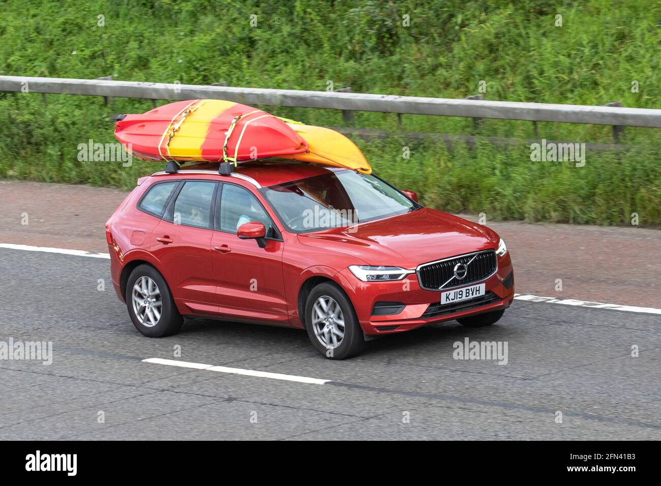 2019 (19) red Volvo Xc Momentum D4 Auto; Vehicular traffic, moving vehicles, cars, vehicle driving on UK roads, motors, motoring on the M6 motorway highway UK road network. Stock Photo