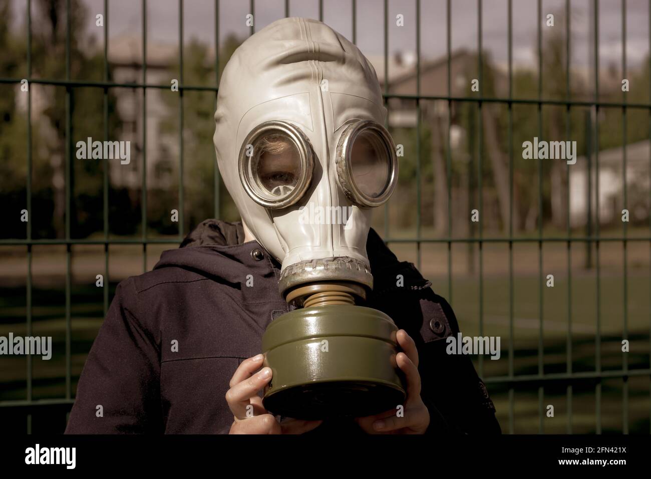 A child in a gas mask. Boy in personal protective equipment Stock Photo ...