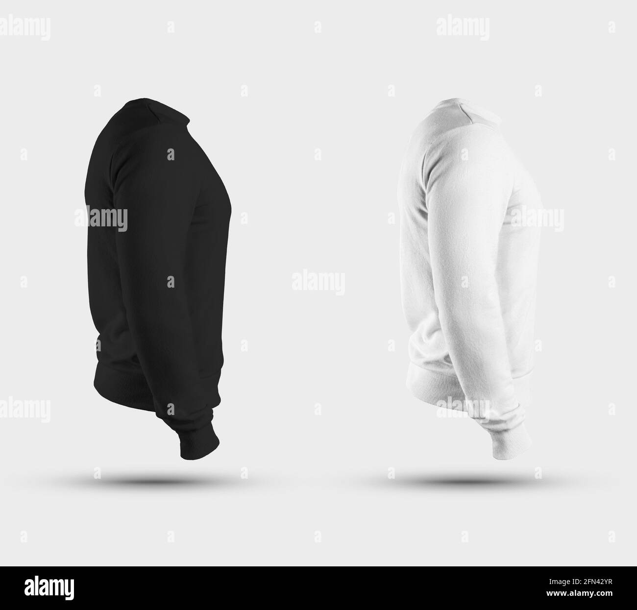 Mockup of white and black textile sweatshirts with straight arms, side view, male blank pullover with long sleeves, for presentation design. Template Stock Photo