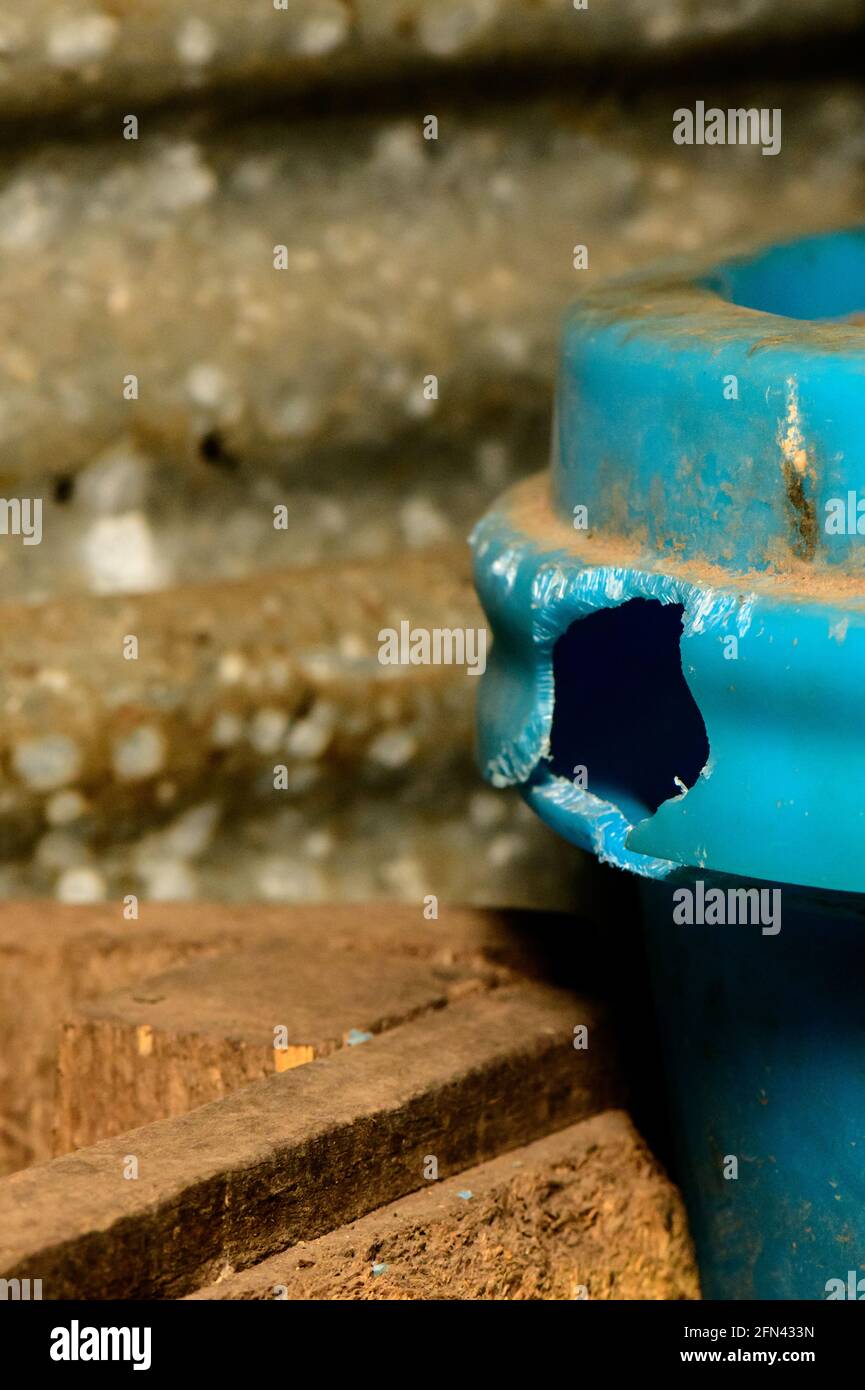 Mice and Rats  have gnawed large hole in plastic feed bin Stock Photo