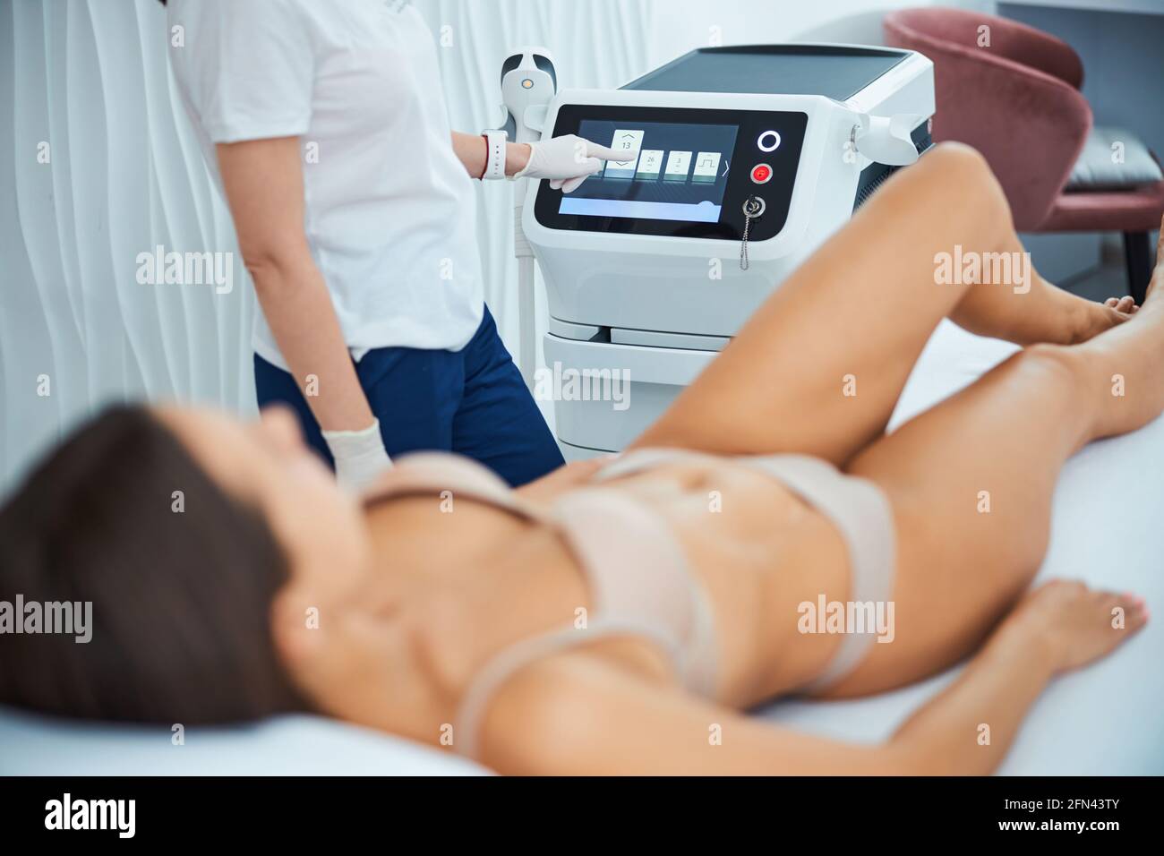 Certified dermatologist preparing a patient for a laser treatment Stock Photo