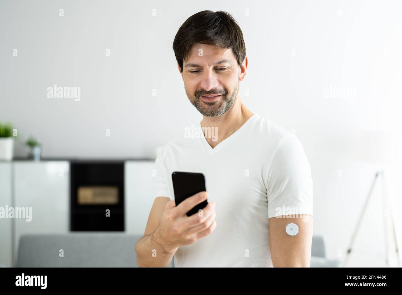 Continuous Glucose Monitor Blood Sugar Test Smart Phone App Stock Photo