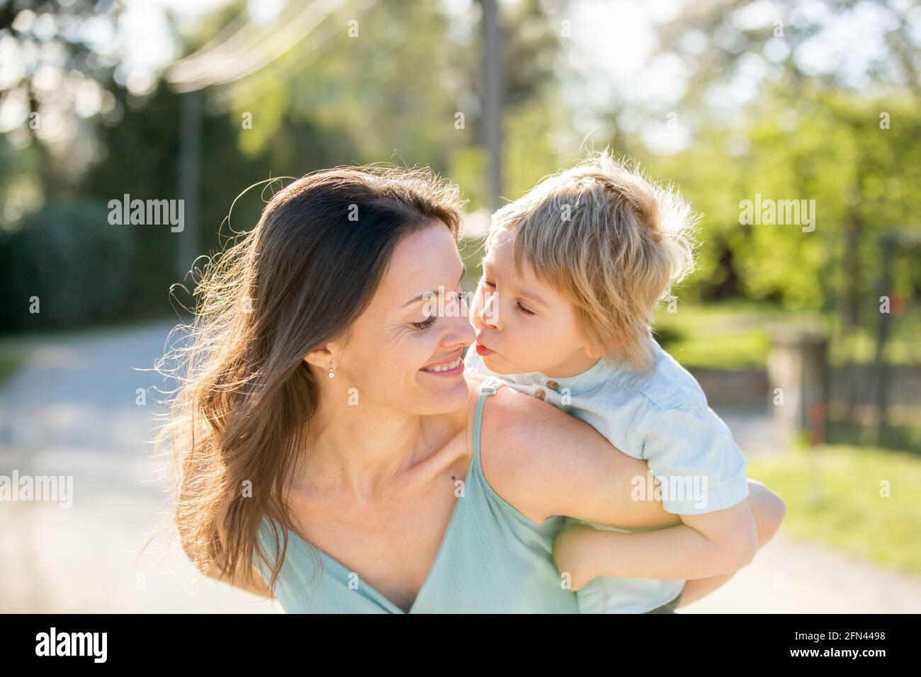 Beautiful family with kids, mom, dad, three boys and a dog, playing in ...