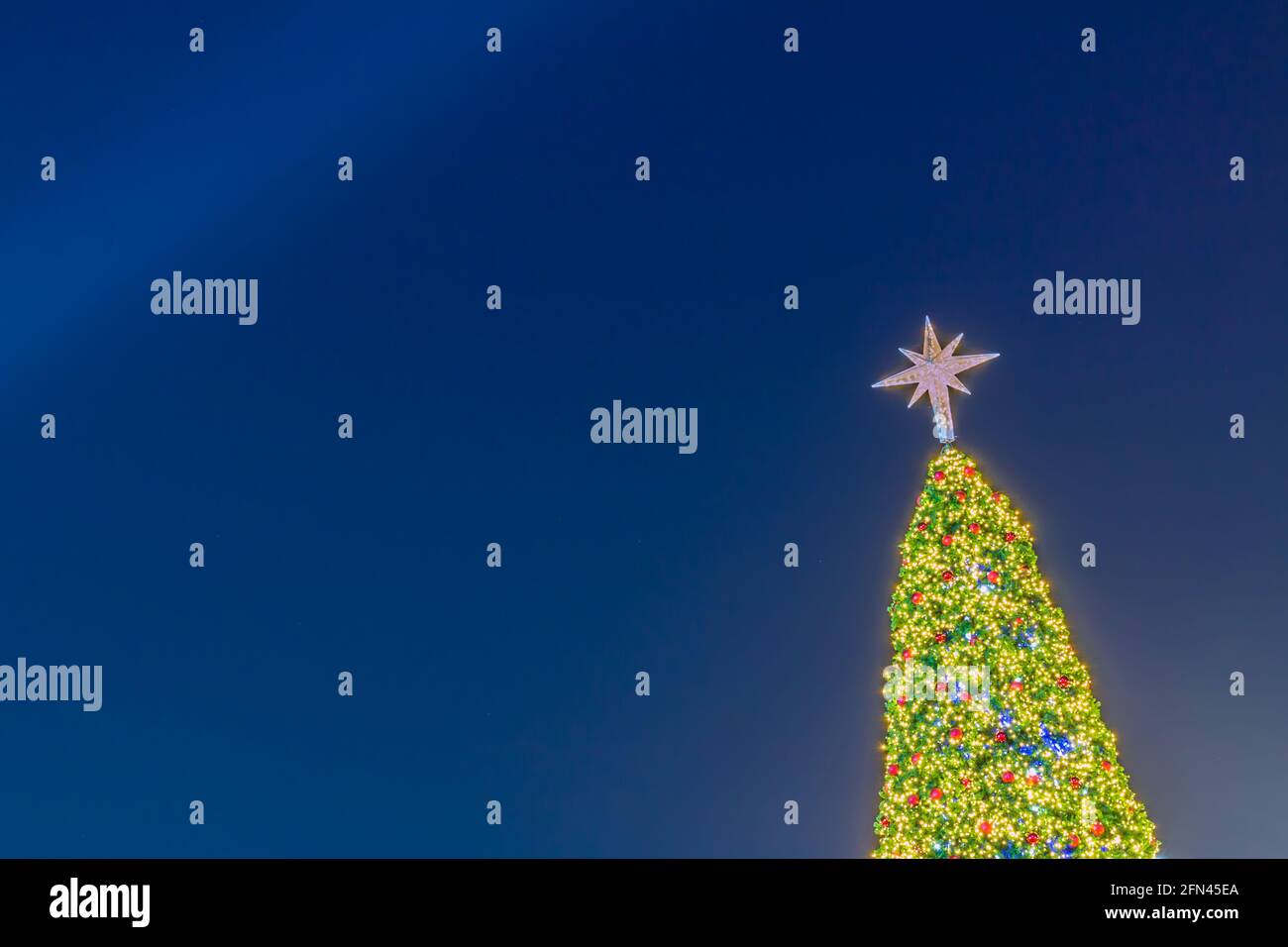 Christmas tree light with decoration on black background Stock Photo ...