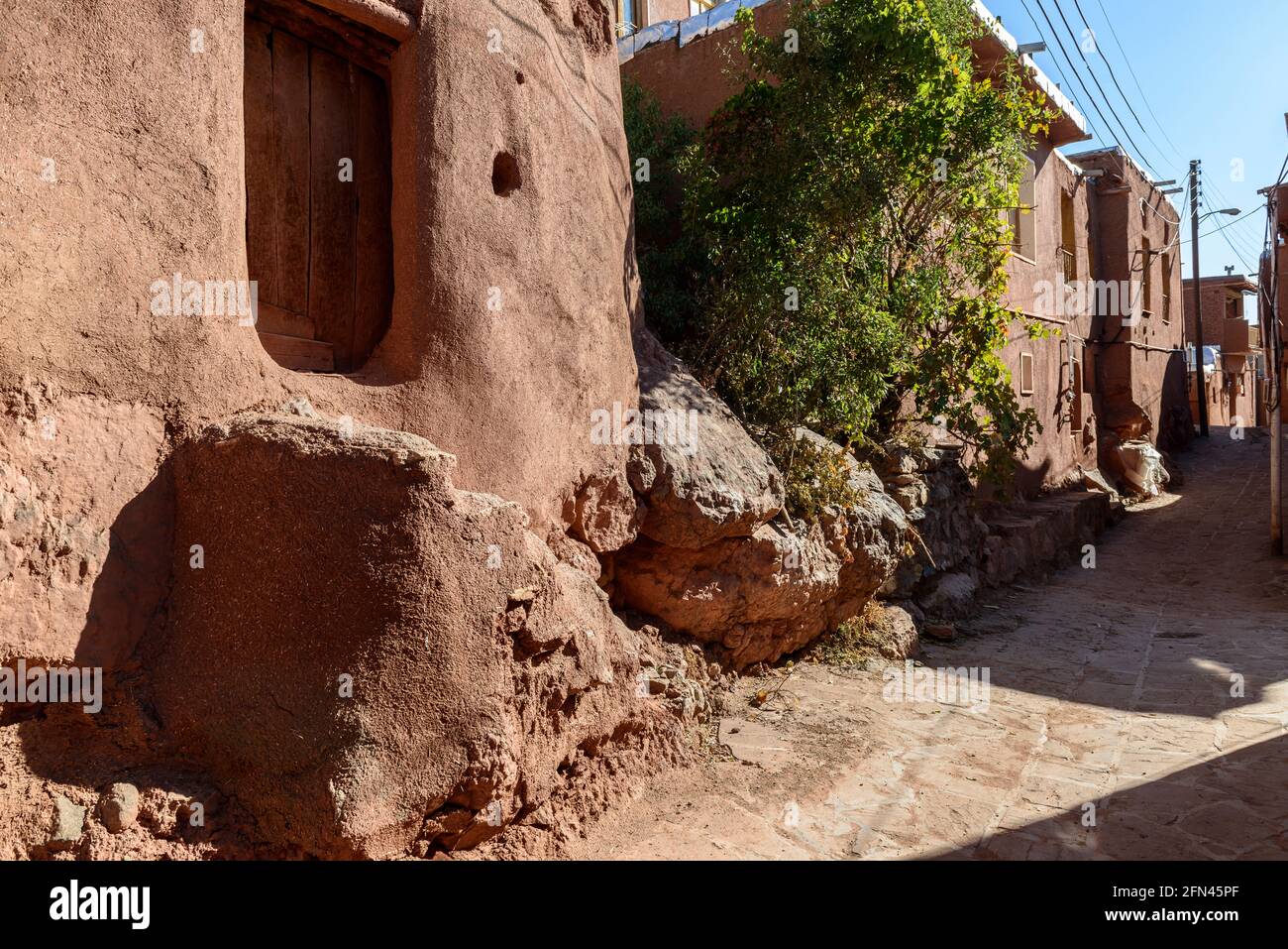 Red coloured earthen hoses in the ancient village Abyaneh, Isfahan Province, Iran. Stock Photo