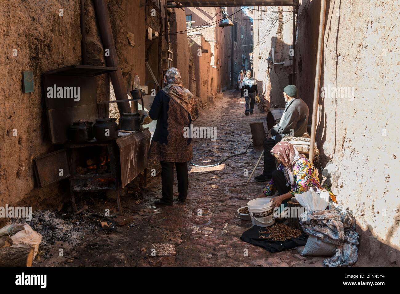 Villagers making tea and refreshments for tourists in the ancient village Abyaneh, Isfahan Province, Iran. Stock Photo