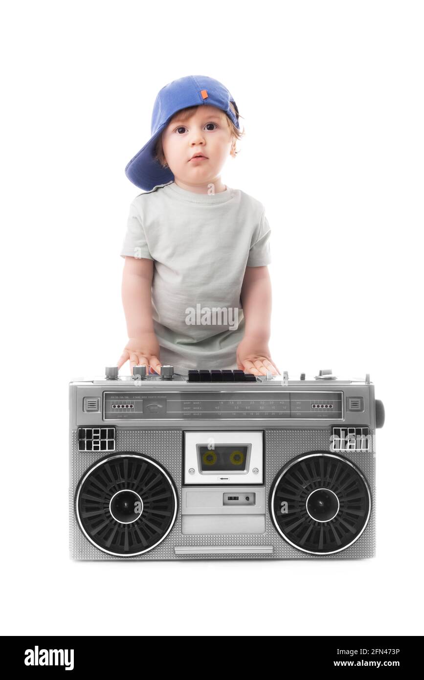 Baby boy enjoying retro boombox radio and hip hop style Stock Photo