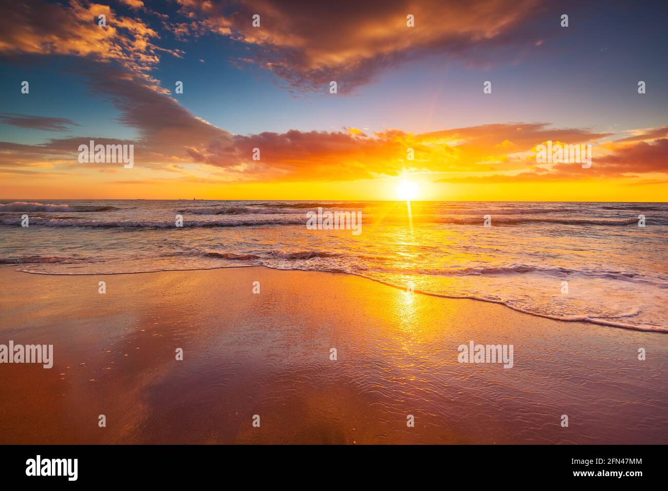 Beach sunrise over the tropical sea Stock Photo - Alamy