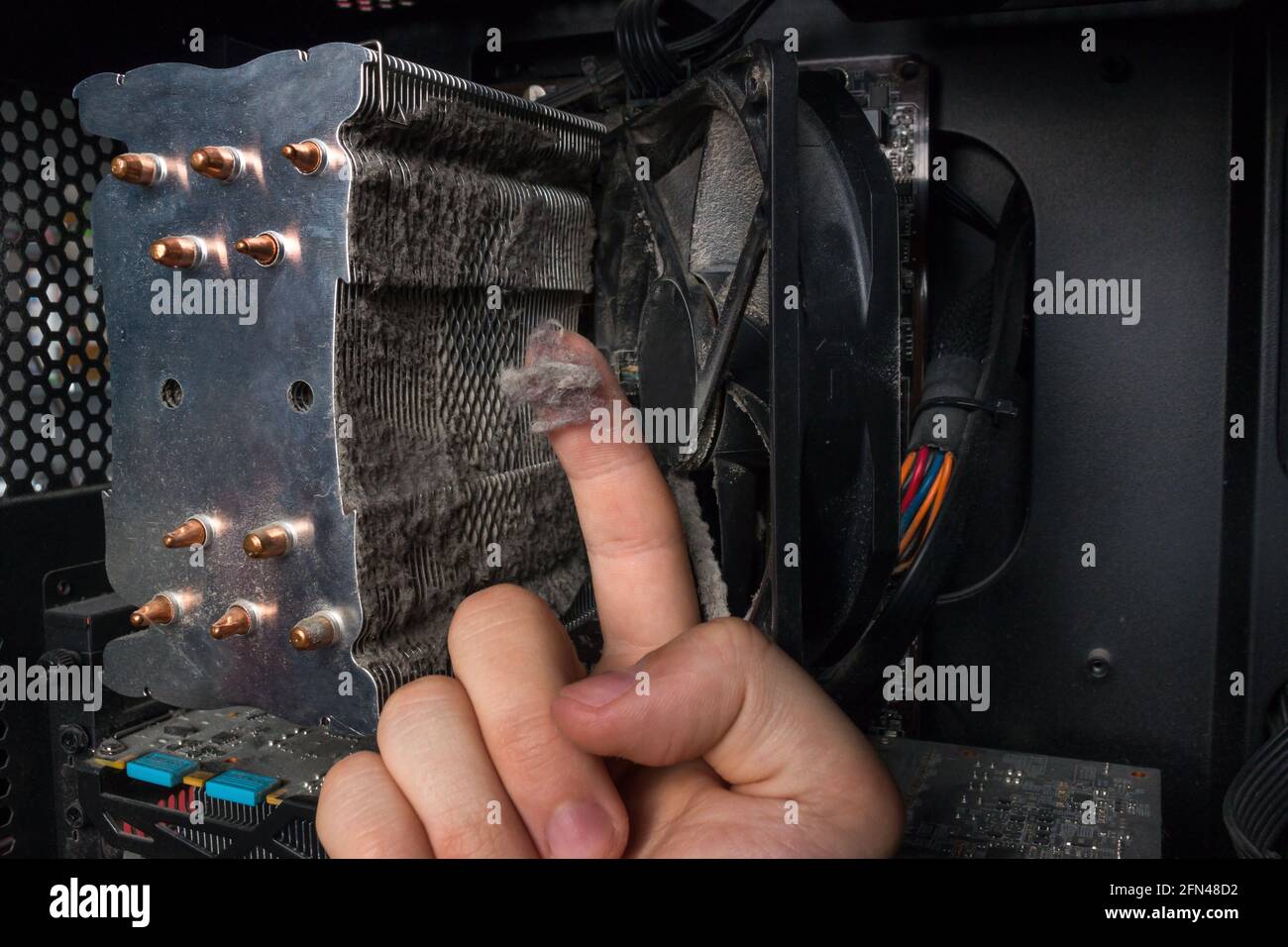 computer technician showed dust, dirt on the PC hardware Stock Photo