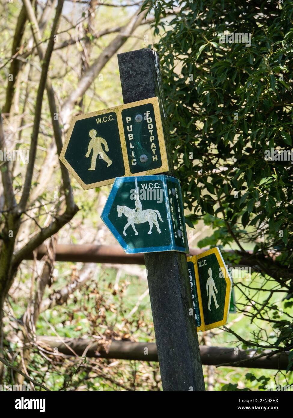 Public footpath and Bridleway signs attached to the same post in Wiltshire, England, UK. Stock Photo