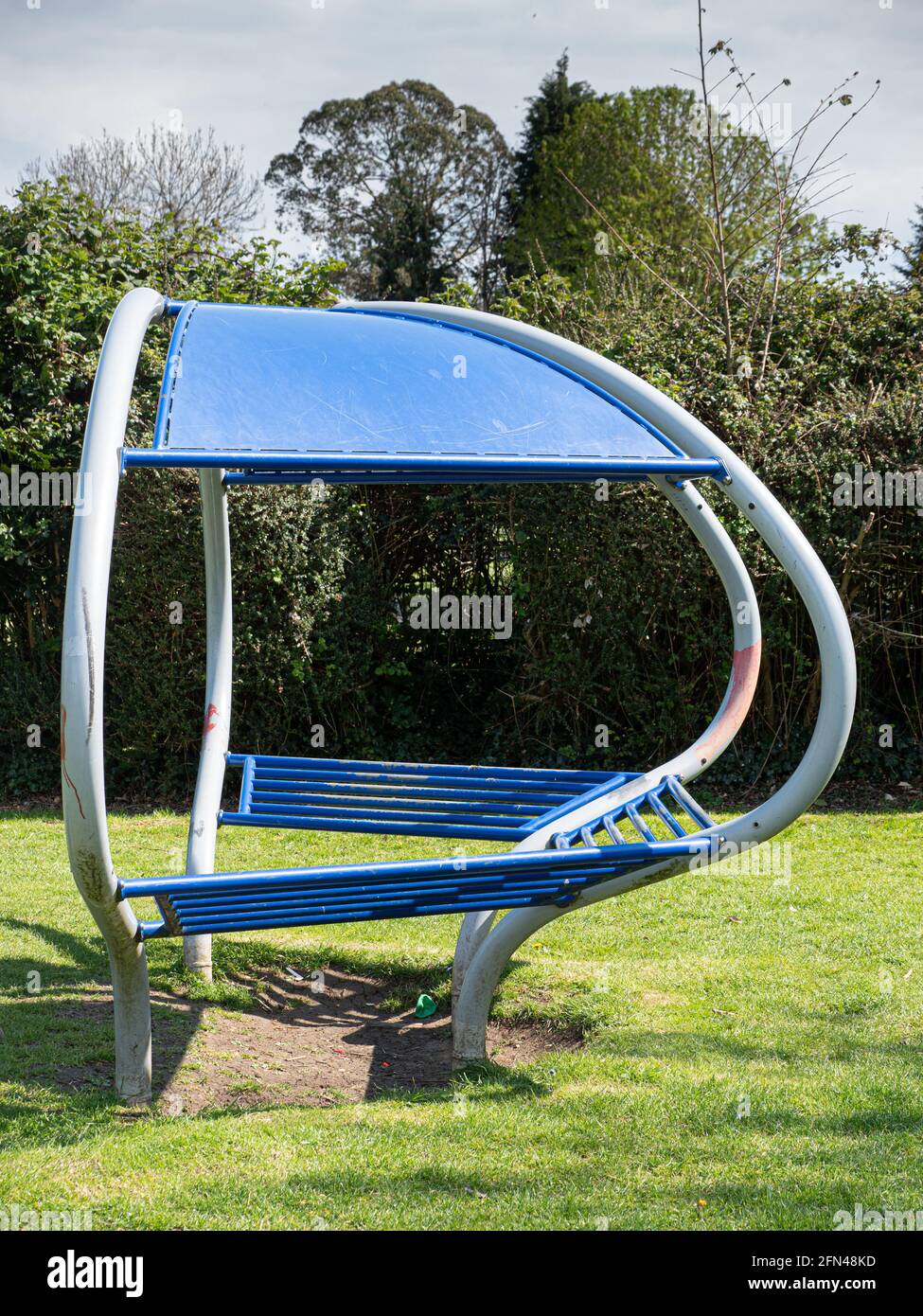 Unusual shaped bench in park in Westbury, Wiltshire, England, UK. Stock Photo