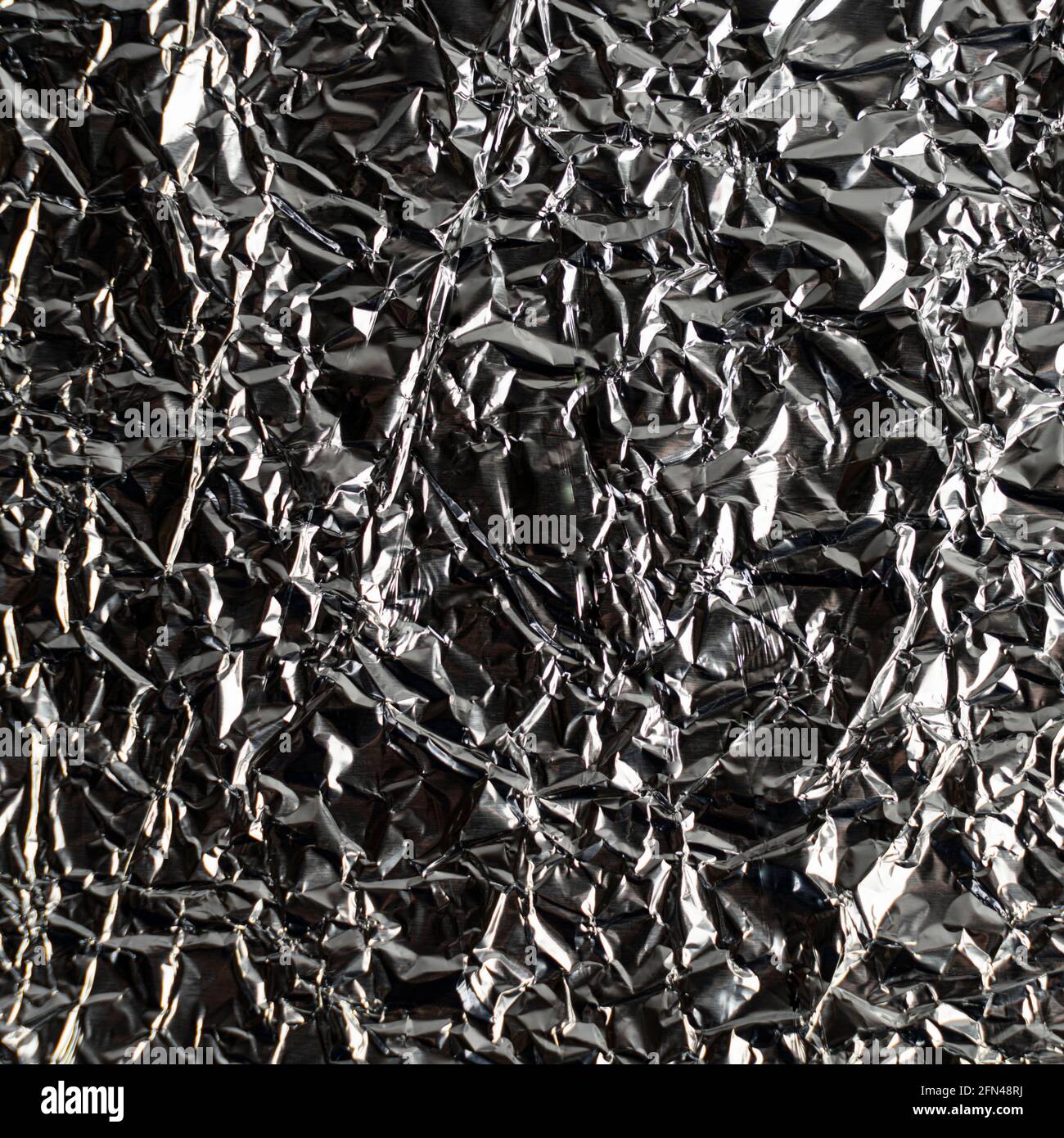 a background made with crumpled aluminum foil Stock Photo
