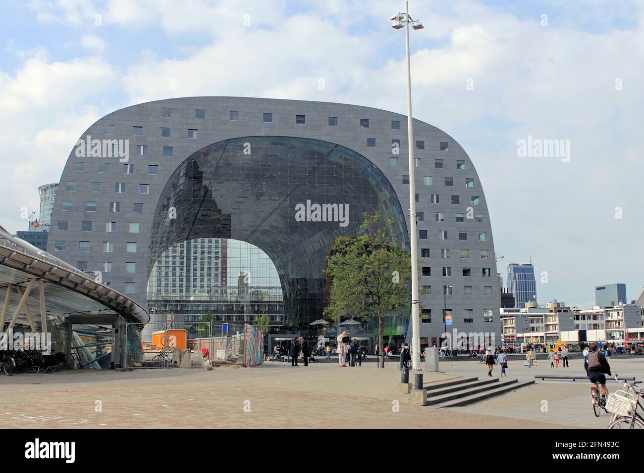 Rotterdam Market Hall. Facade of the famous curved palace with strolling tourists. Stock Photo