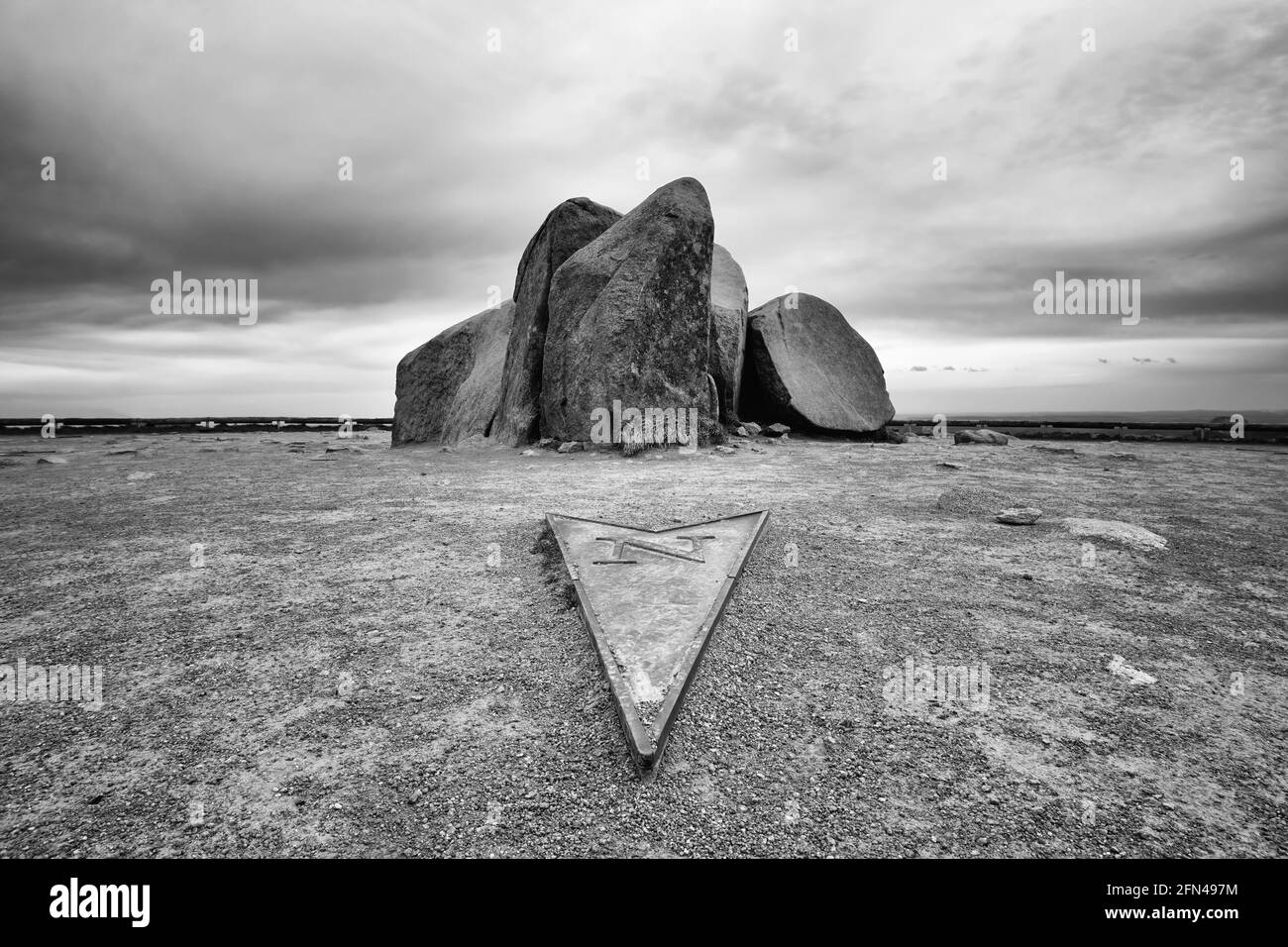 Summit stone of Mount Brocken in the Harz National Park, Saxony-Anhalt, Germany. Monochrome, black and white photography. Stock Photo