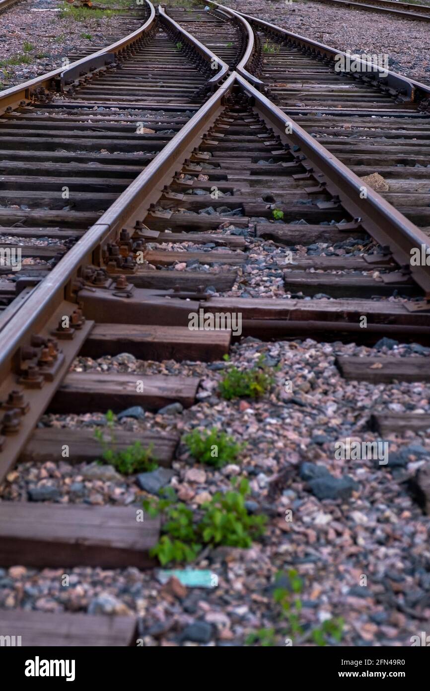 Helsinki / Finland - MAY 13, 2021: Closeup of a retro-style railway track with wooden sleepers. Stock Photo