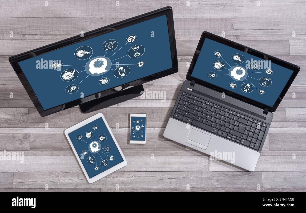 Time management concept shown on different information technology devices Stock Photo