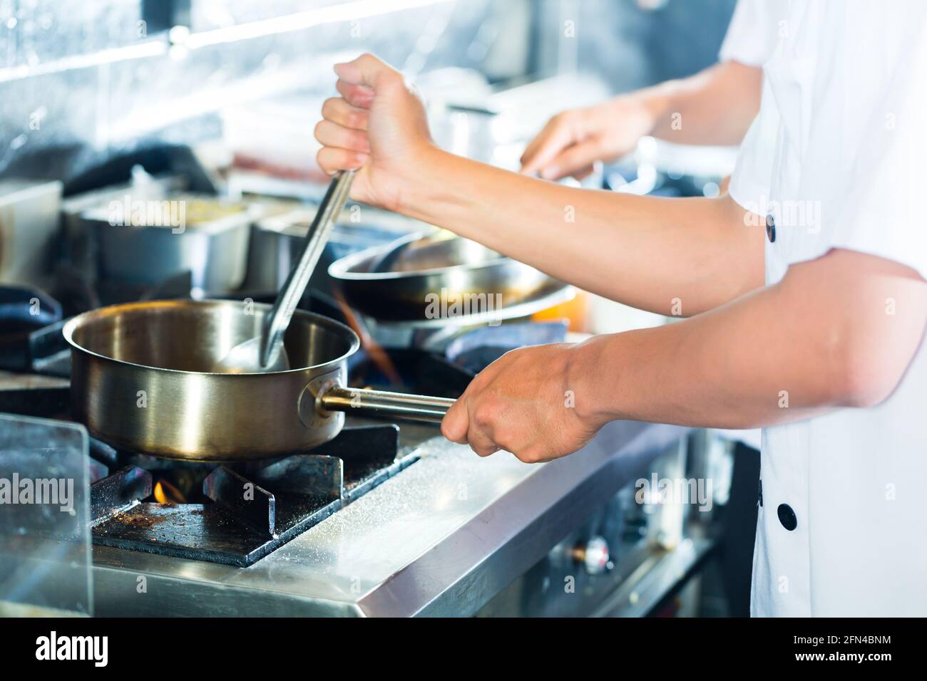 Close up hands chef stirring hi-res stock photography and images - Alamy