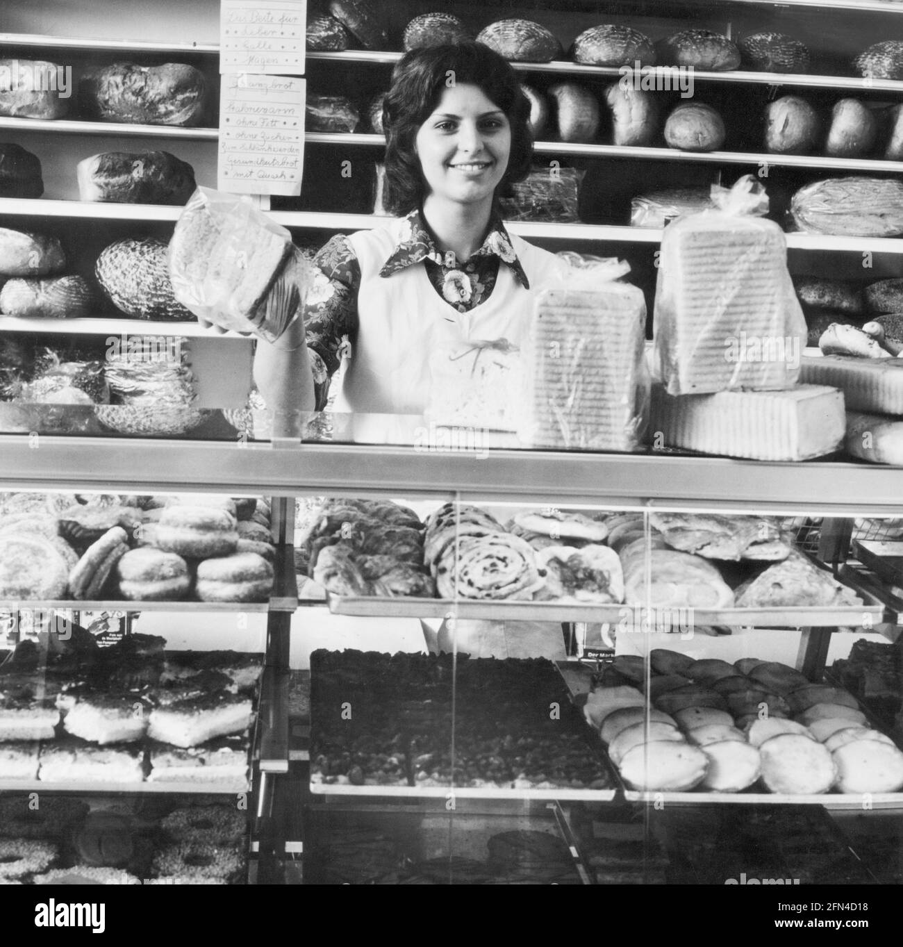 people-profession-baker-bakery-sales-assistant-behind-the-counter-1960s-additional-rights-clearance-info-not-available-2FN4D18.jpg