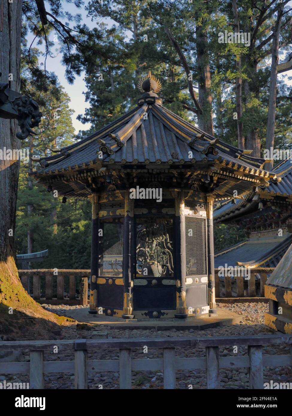Ancient and small baroque lantern in the park of Toshogu shrine, Nikko. Dutch Shinto style chandelier. Stock Photo