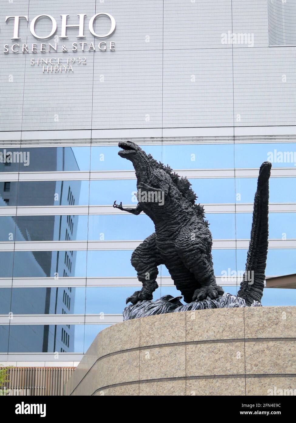 Shin Godzilla statue in Hibiya Godzilla Square. Huge statue of the famous radioactive monster in front of a revamped shopping mall. Stock Photo